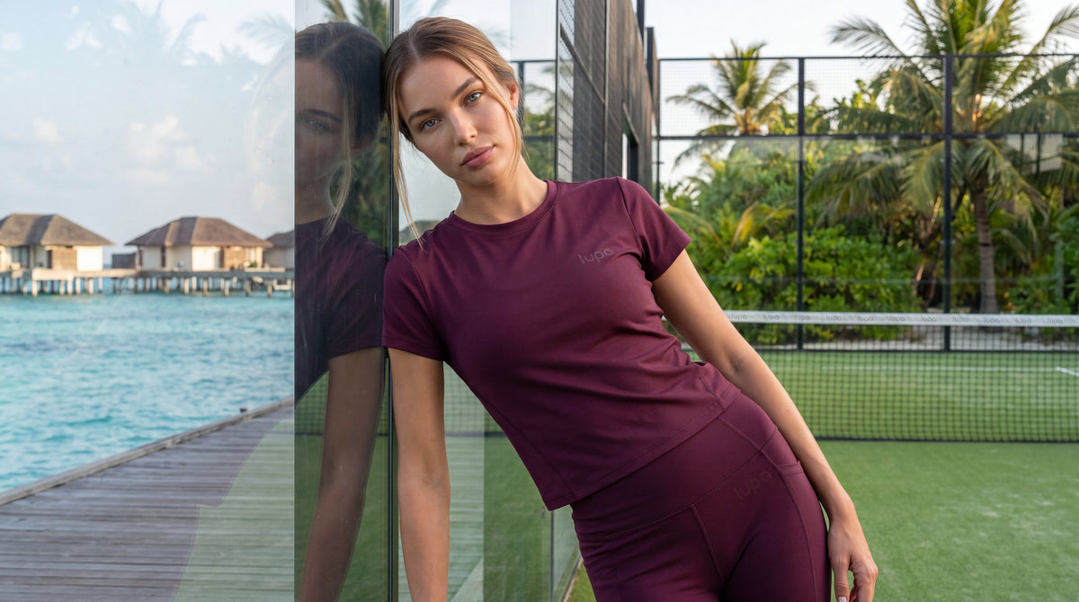 LUPA womens campaign - berry outfit at Maldives padel court